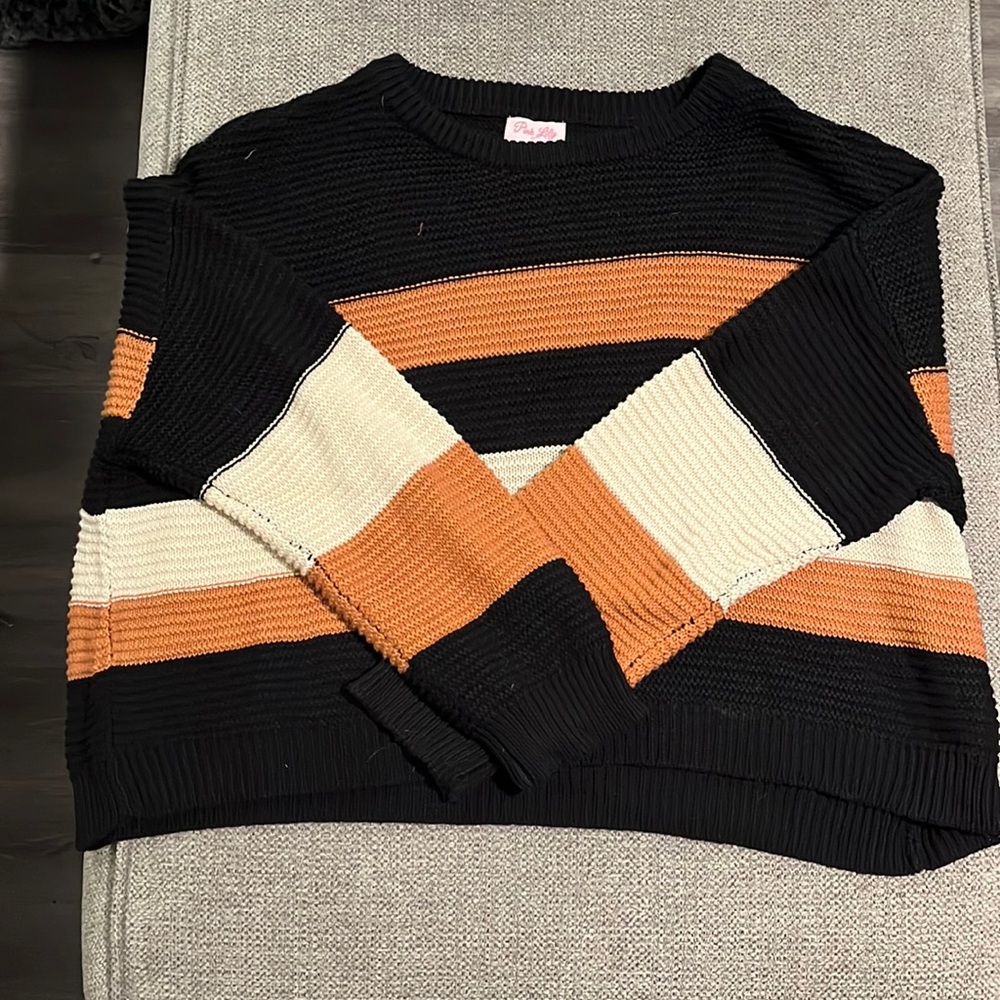 Black, tan, white sweater